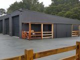 Black four bay farm and lifestyle shed by Coresteel Buildings